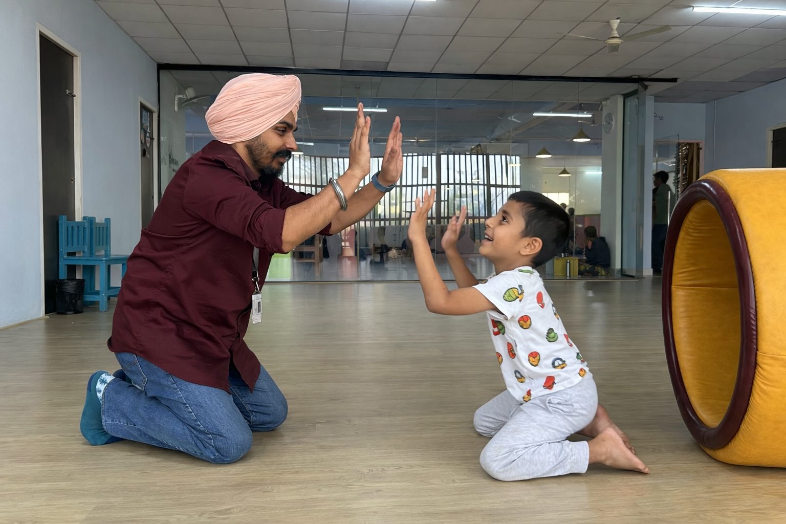 A high-five between a mentor and a child