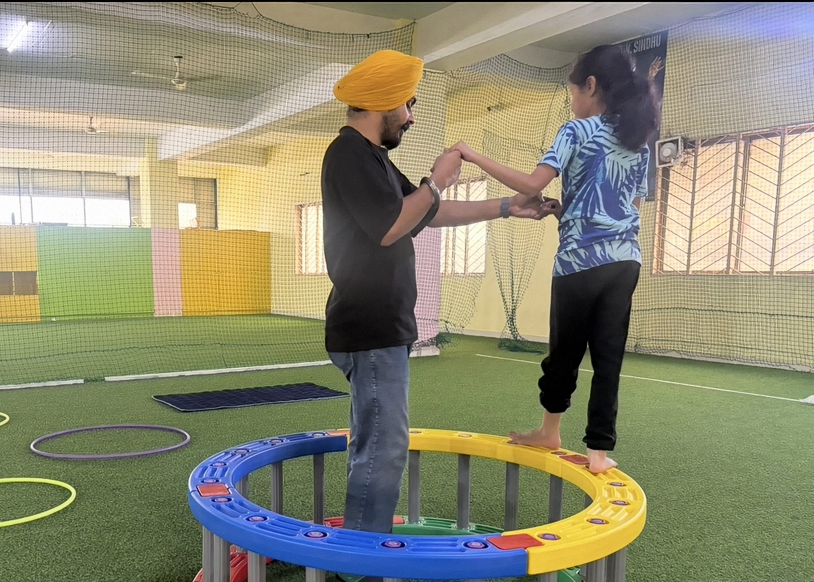 A child practising balance with support