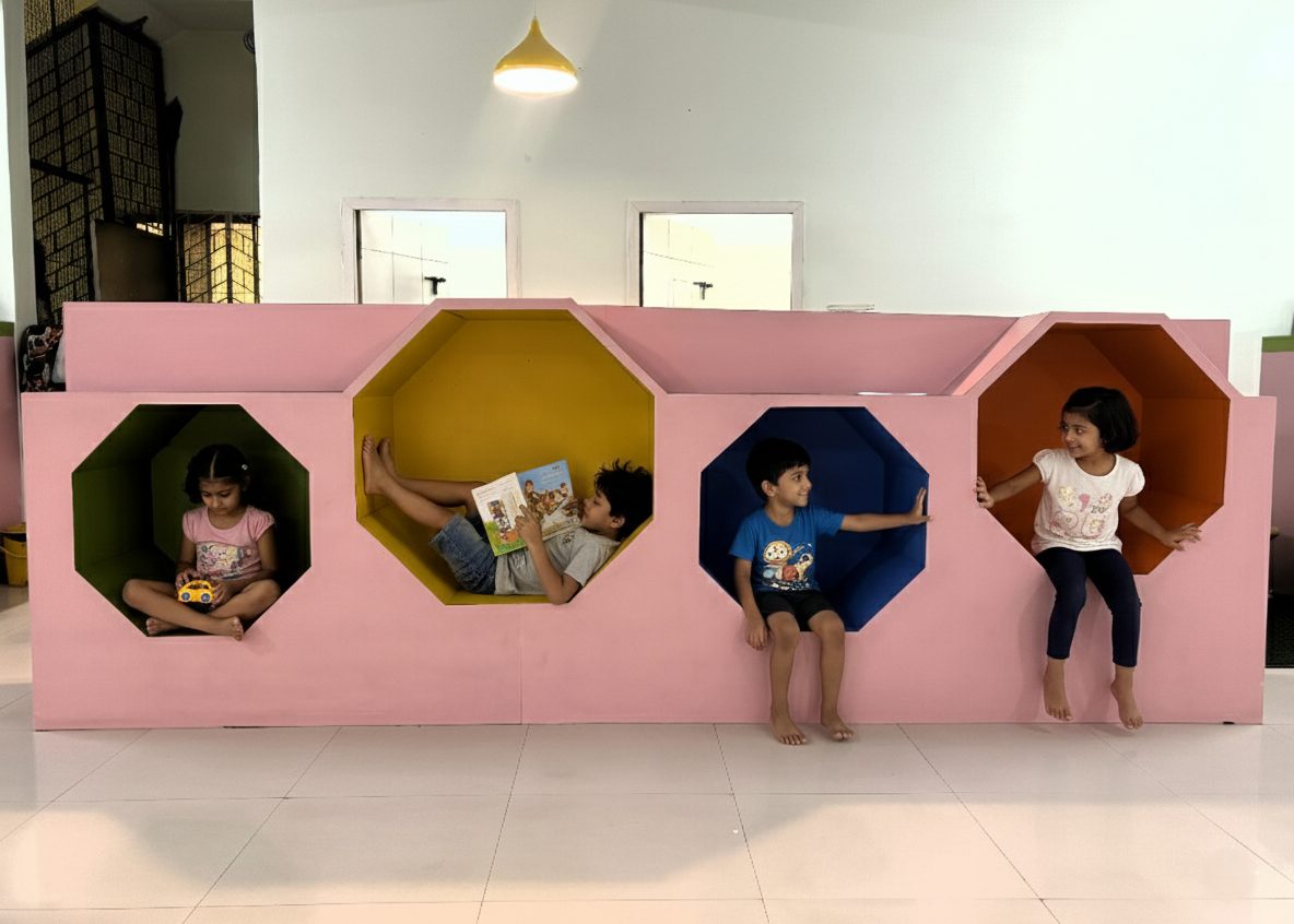 Children relaxing in colourful reading nooks