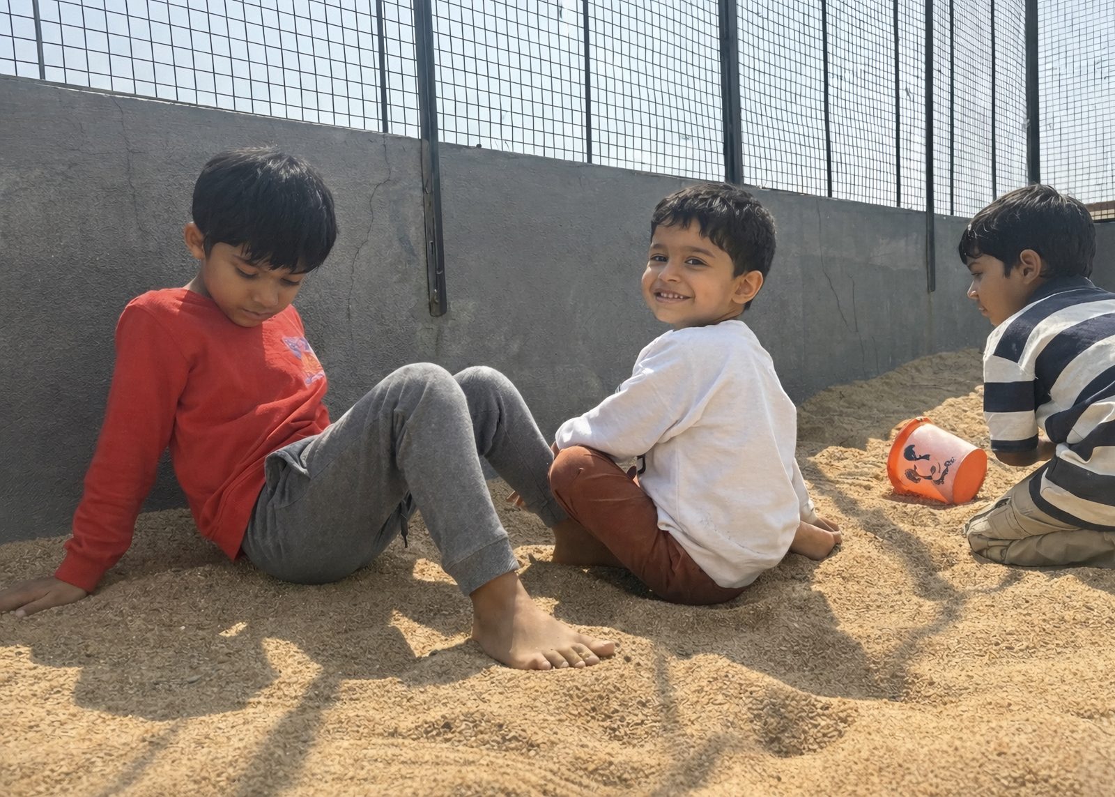 Children playing together in sand