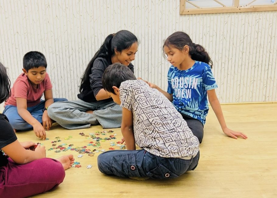 Children solving a puzzle together